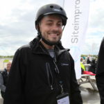 Siteimprove employee wearing branded bike helmet