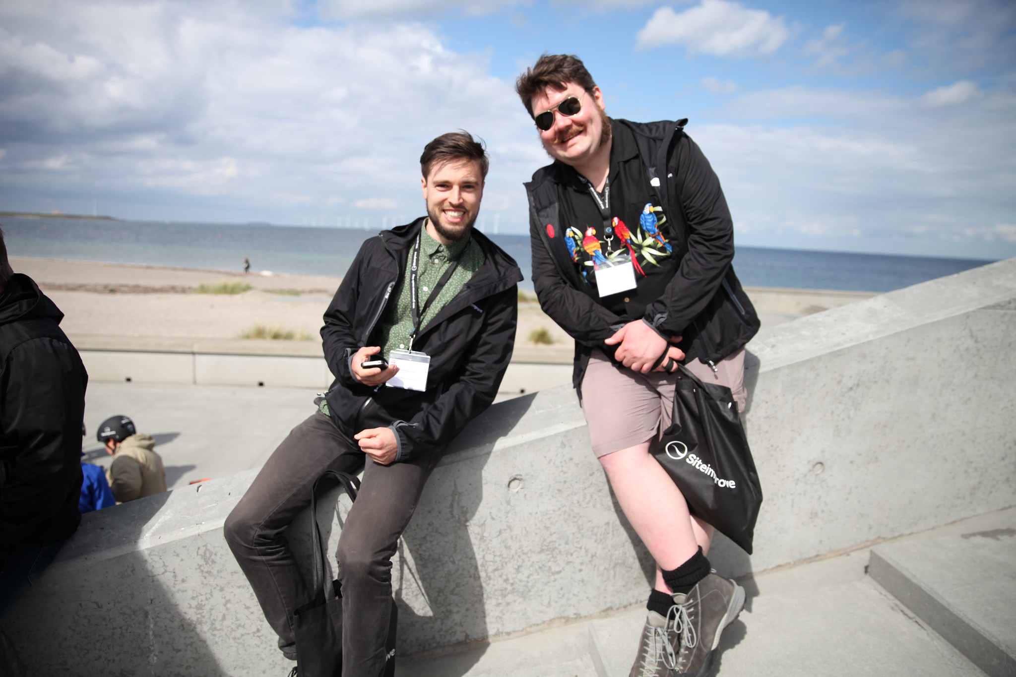 Two Siteimprove employees posing on a beach on GAAD 2015