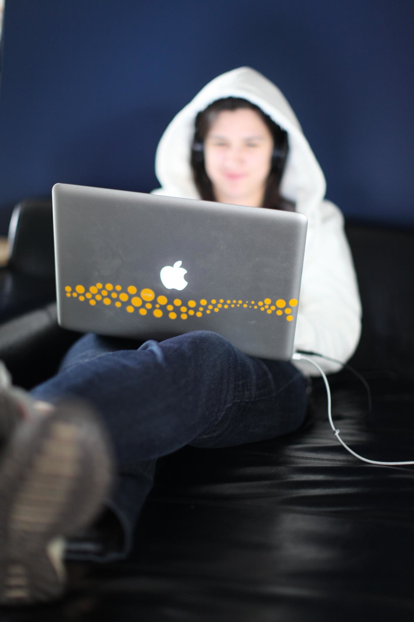 Angie working from couch