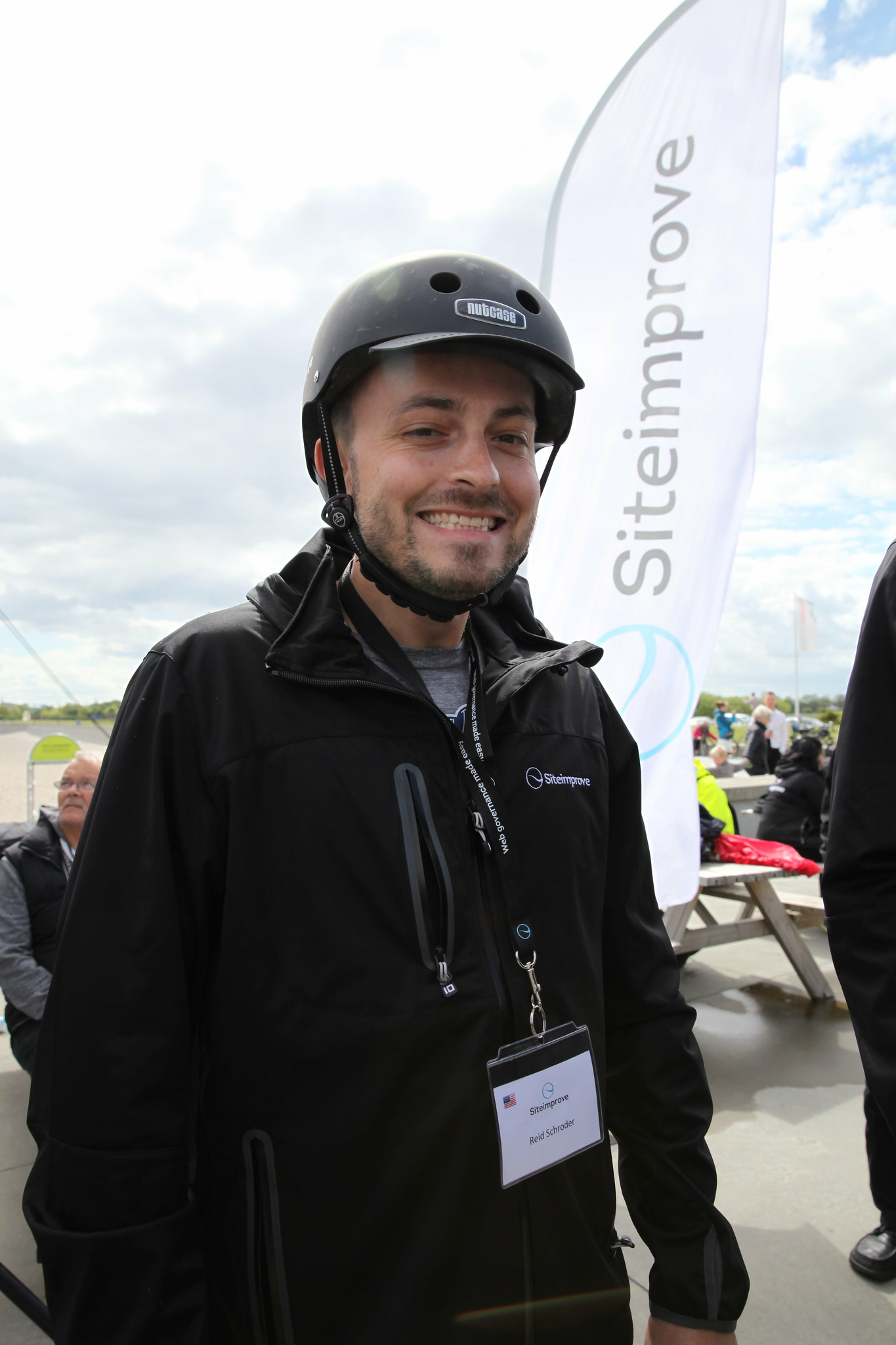 Siteimprove employee wearing branded bike helmet