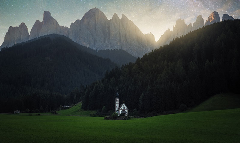 church in scenic setting with mountains