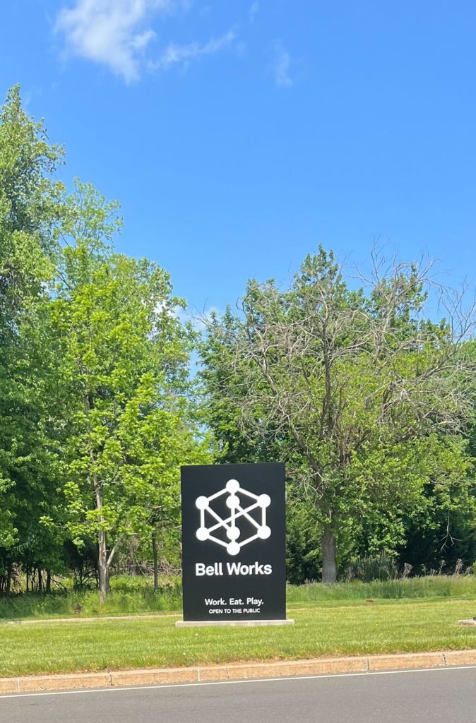 The Bell Works sign outside of the driveway to the building